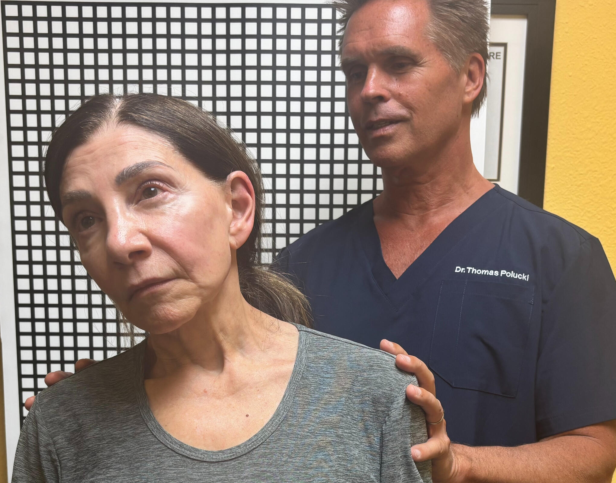 Santa Clarita chiropractor Dr. Thomas Polucki discussing a cervical spine scan with a patient during a consultation