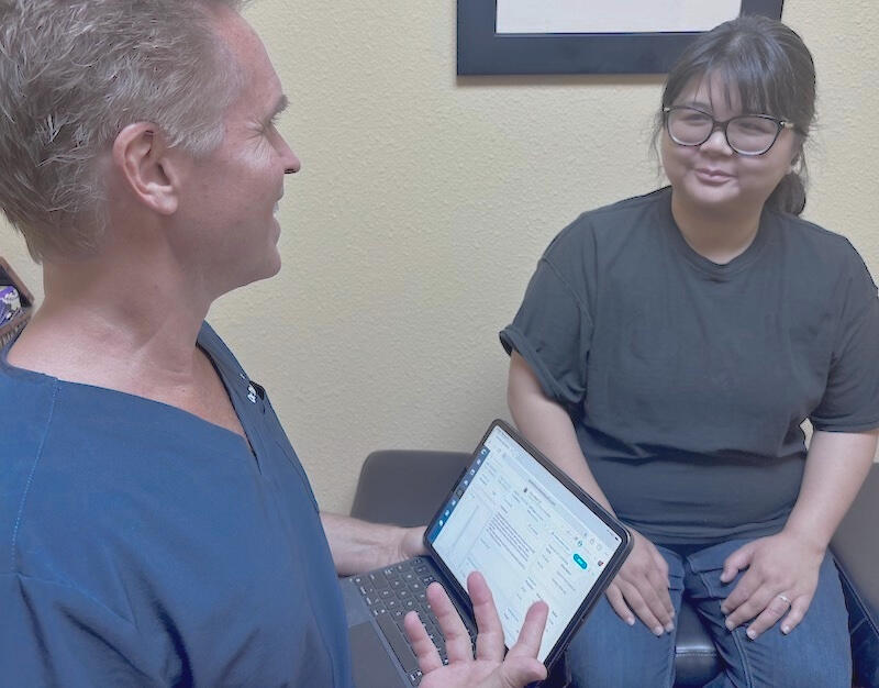Santa Clarita chiropractor Dr. Thomas Polucki in consultation