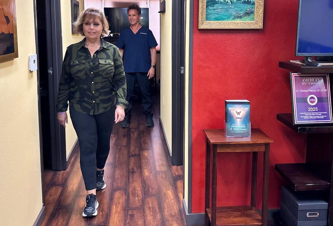 Dr. Thomas Polucki evaluating walking and balance patterns related to sciatica during a chiropractic visit in Santa Clarita.